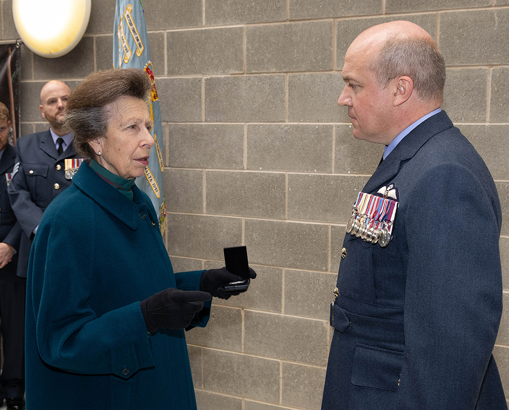 Her Royal Highness presenting a King’s Commendation for Bravery in the Air to Flight Lieutenant Howell for his crew’s heroic efforts in saving 14 fishermen during a South Atlantic Search and Rescue operation.